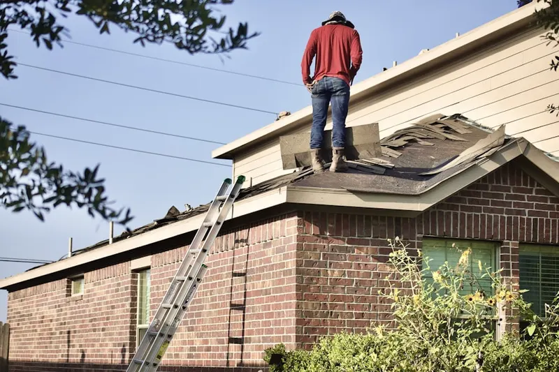 Professional roofer working on a residential roof in Los Angeles